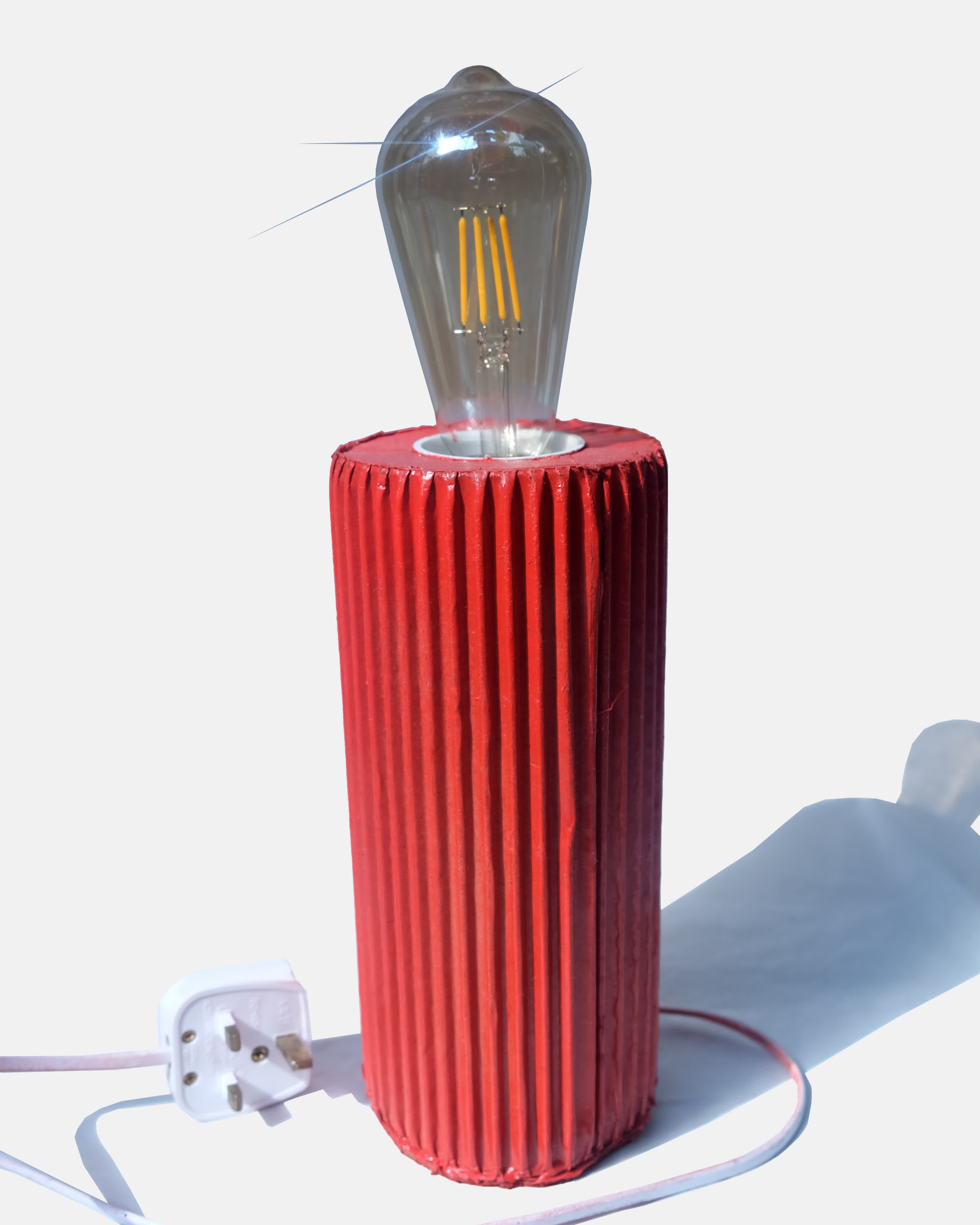 Cylindrical cardboard light painted red